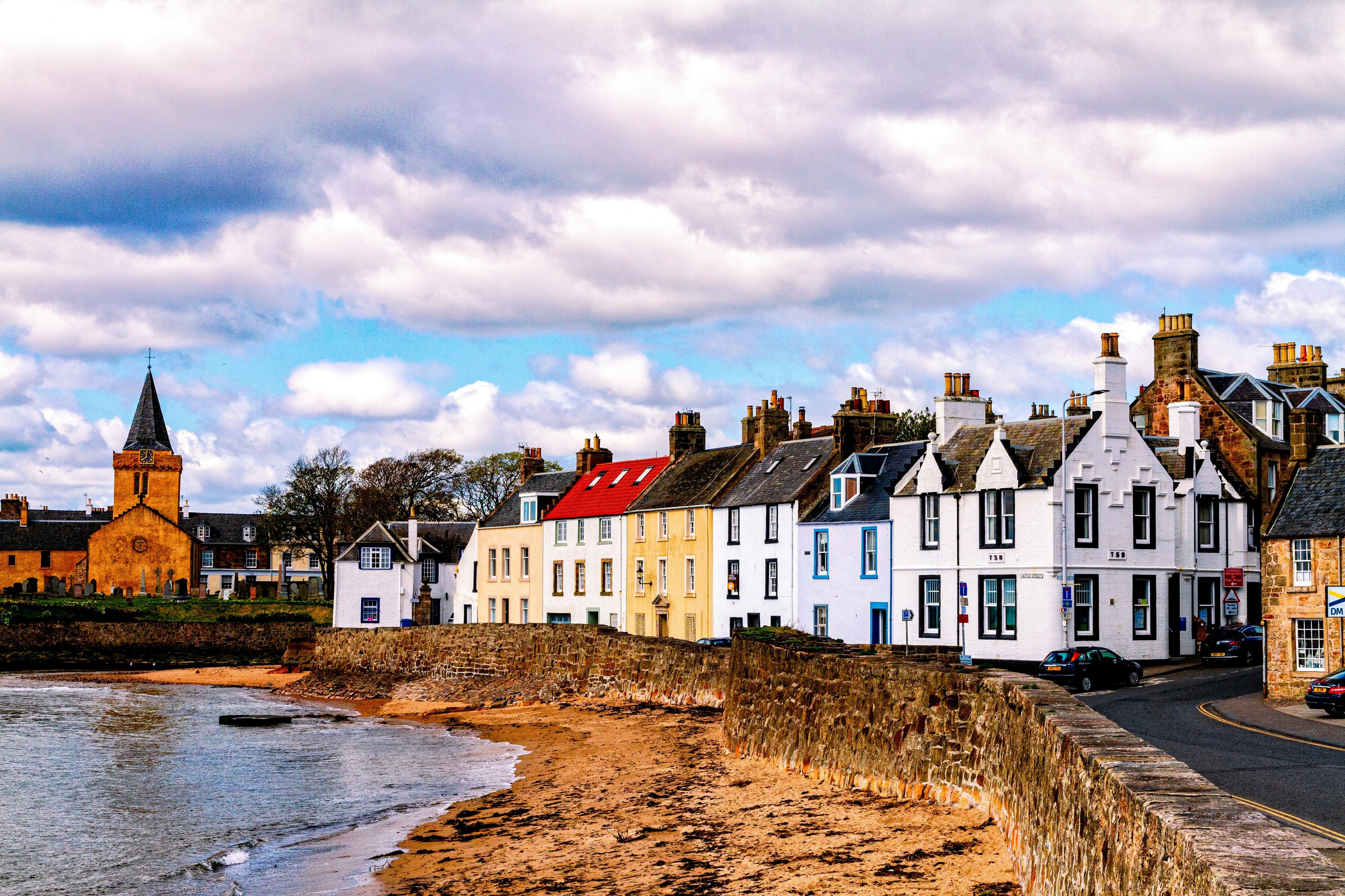 Colorful houses on a coastal road in Scotland