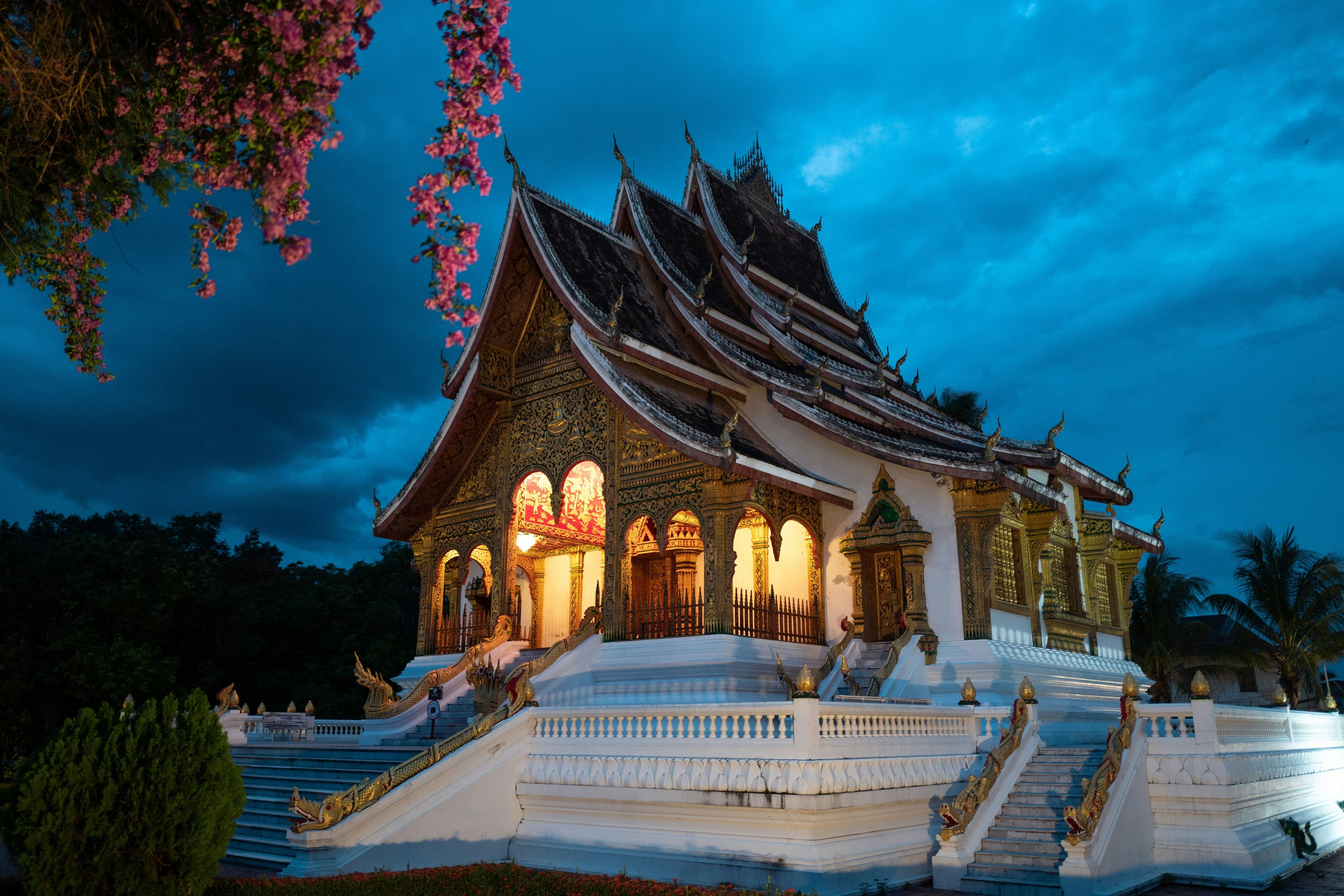A lit temple on a dark day in Luang Prabang