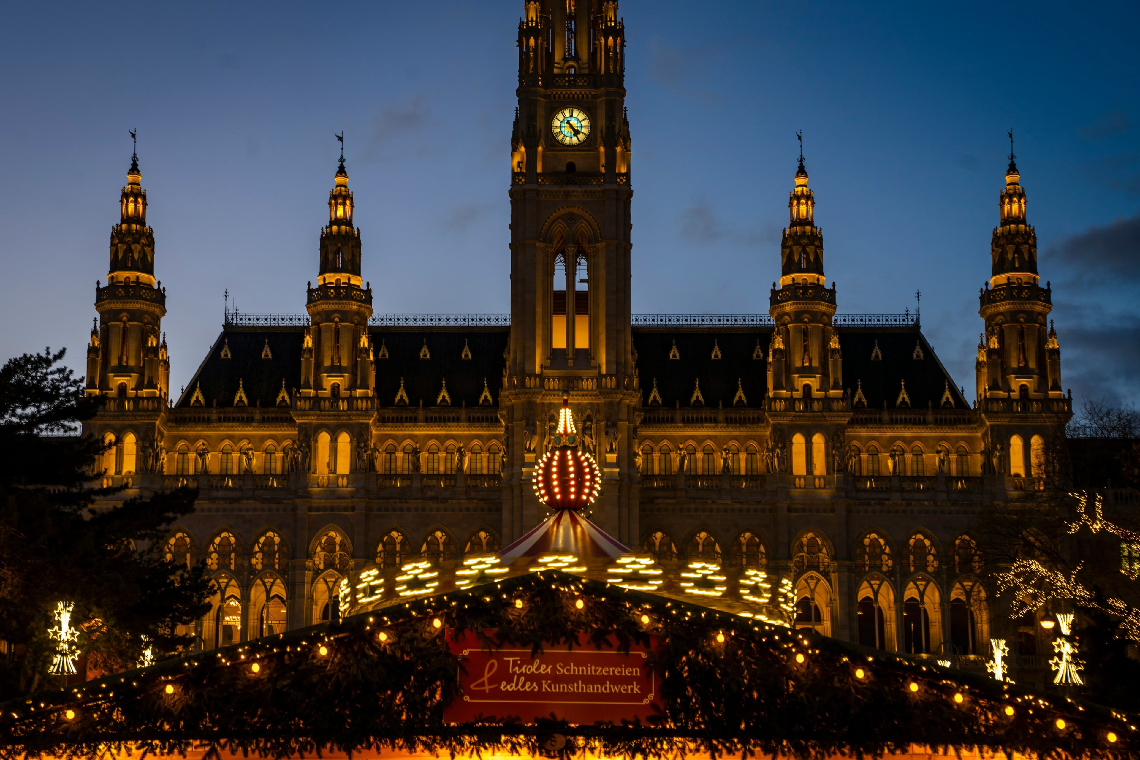 Christmas market in vienna in the dark in front of a church