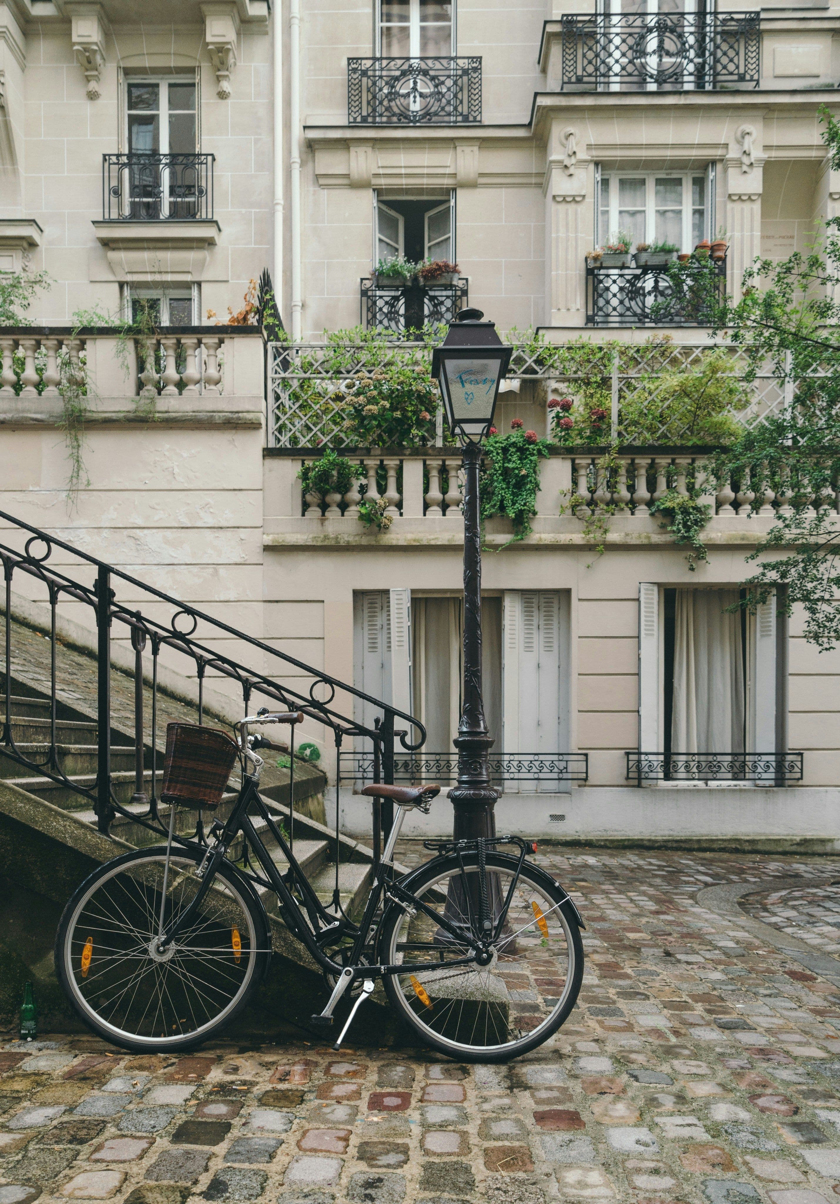 Paris cobbled street with a bike against a lamppost