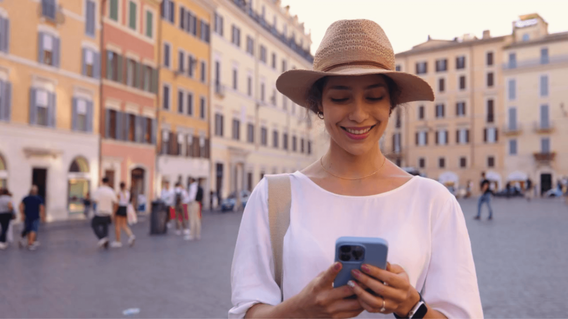 Woman holding smartphone in city center