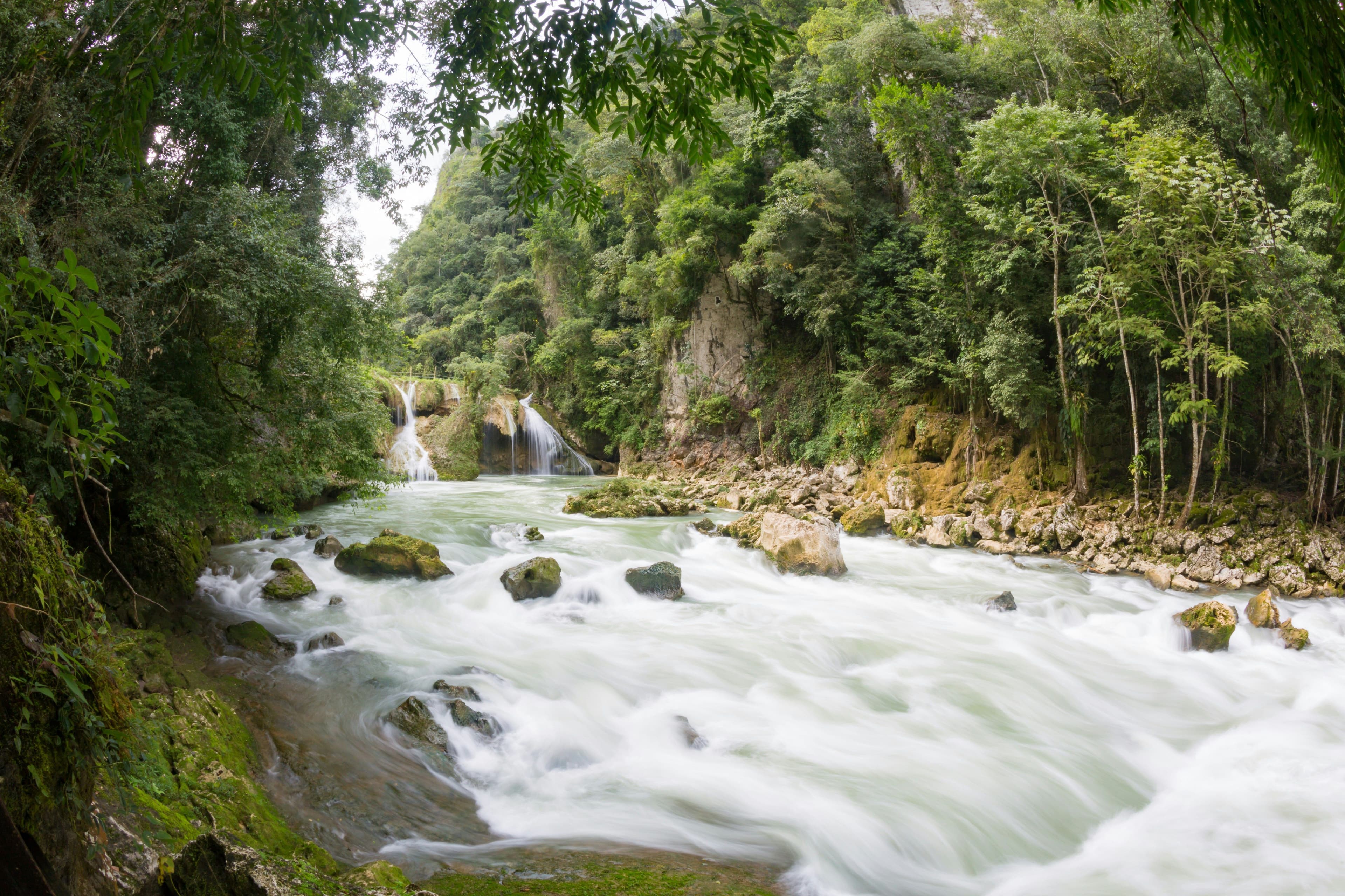 low waterfall in a rain forest in guatemala